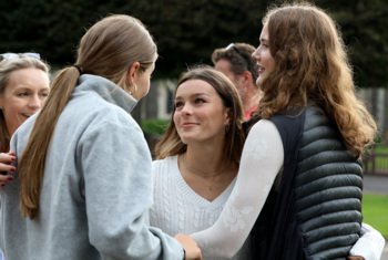  Pupils happily celebrating each others results on GCSE Results Day in the Quad 