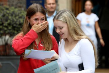  Pupils overwhelmed with emotions showing  each other their results on GCSE Results Day 