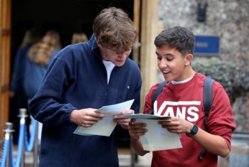  Pupils showing one another their A-Level results and celebrating their success together in the Quad 