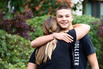  Pupil happily hugging their proud Mum on Results Day 