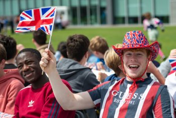  Pupils with Great Britain hats and flags enjoying celebrations for the Platinum Jubilee 