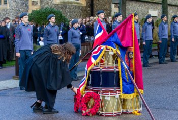  Head of School laying the wreath with uniformed CCF cadets in the background 