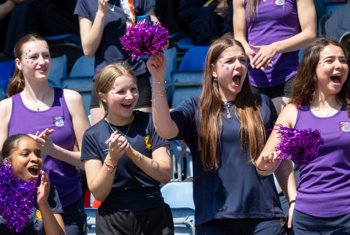  Chichester House pupils cheering on their house in a Sports Day track event 