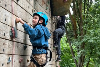  Upper Third pupil on a climbing wall on a residential trip to Kingswood Outdoor Activity Centre 