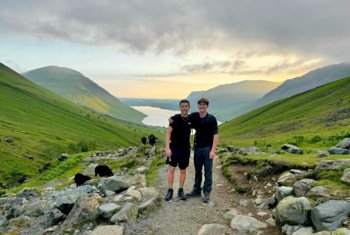  Walking up Scafell Pike as part of the Three Peaks Challenge as the sun is setting 