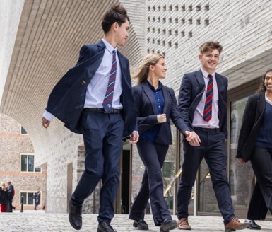  Sixth Form pupils enjoying talking to each other outside the Richard Cairns building 