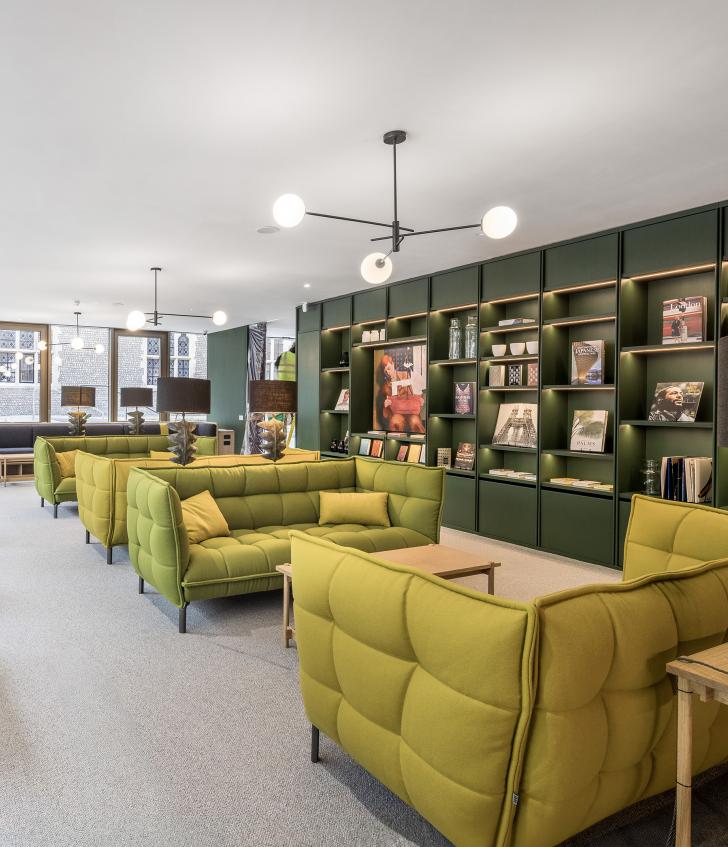  Socialising area in the Sixth Form Club with sofas and bookshelves 