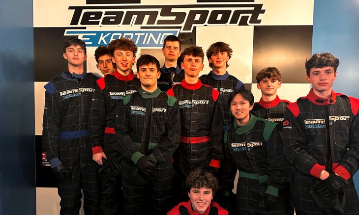  Pupils in boiler suits enjoying a tutor group trip to Go Karting 