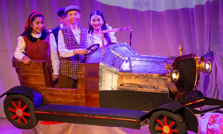  Prep School pupils on stage in the car performing in their production of Chitty Chitty Bang Bang 