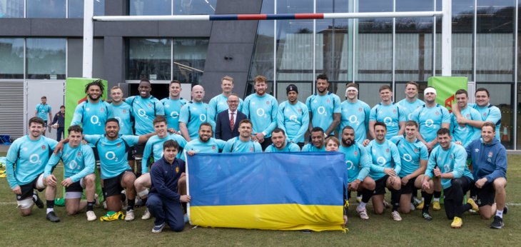  England Rugby team by the posts in front of the SSS with a Ukraine flag 