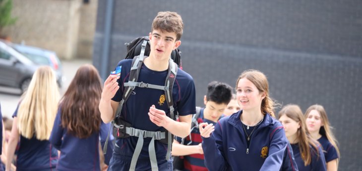  DofE pupils on the stairs of the SSS walking the distance of Everest for charity 