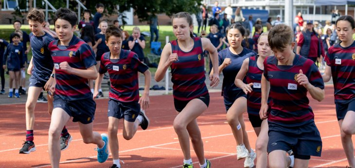  Lower School pupils running the 1500m race on the track at Sports Day 