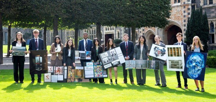  GCSE and A-Level Art and Photography pupils in the Quad holding their coursework pieces 