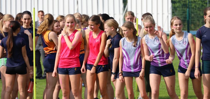  Pupils in their house vests on the start line on the Home Ground for the Pope Relay 