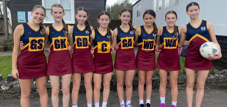  Prep School U13A Netball Team with their bibs and dresses on 