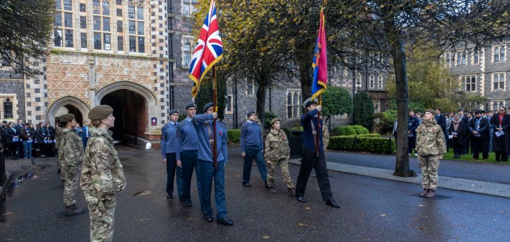  Pupils in CCF holding flags on parade for Remembrance Day 