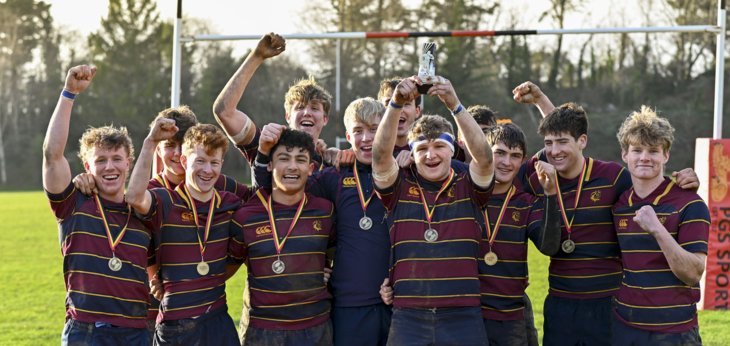  Winners of the South Coast 7s Rugby Tournament standing on the pitch celebrating with their medals 