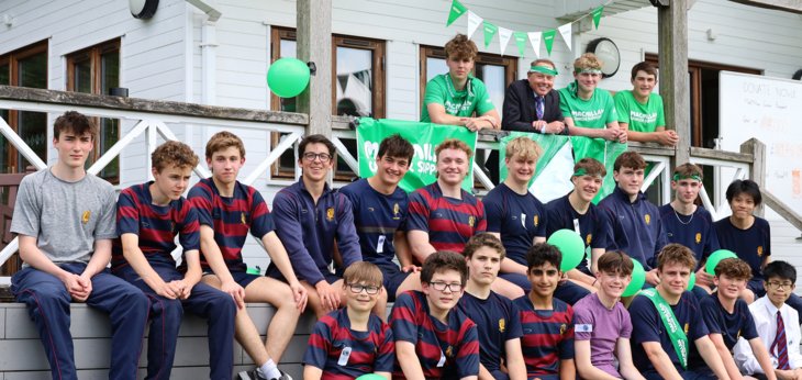  School House pupils and Richard Cairns celebrating finishing their relay to raise money for Macmillan 