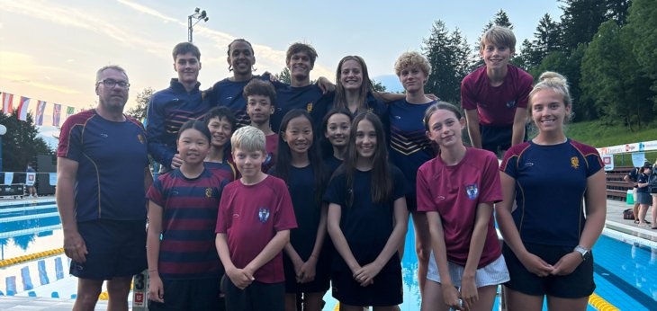  Pupils and Staff enjoying their Swimming Tour to Slovenia in front of a pool 