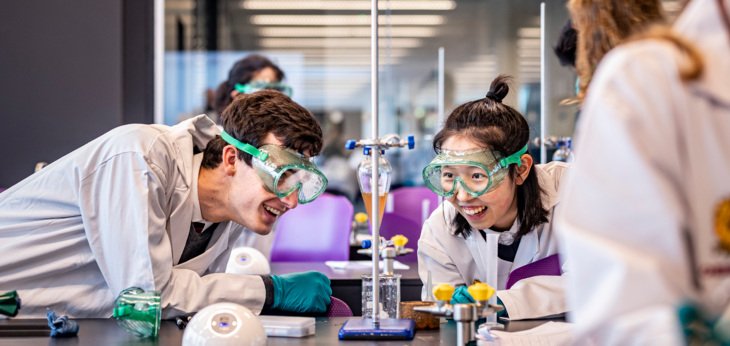  Pupils in a Chemistry lesson enjoying a titration experiment 