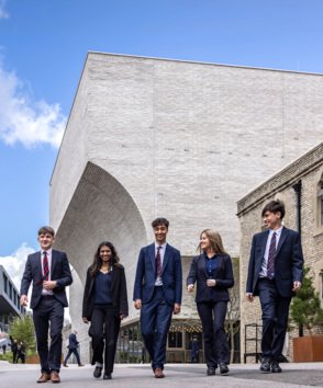 Pupils enjoying themselves whilst walking outside the Richard Cairns building