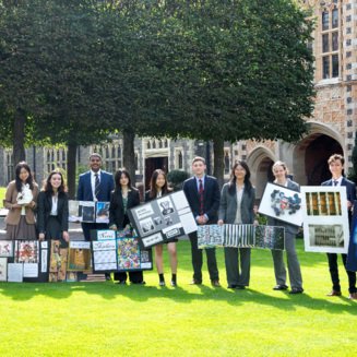 GCSE and A-Level Art and Photography pupils in the Quad holding their coursework pieces