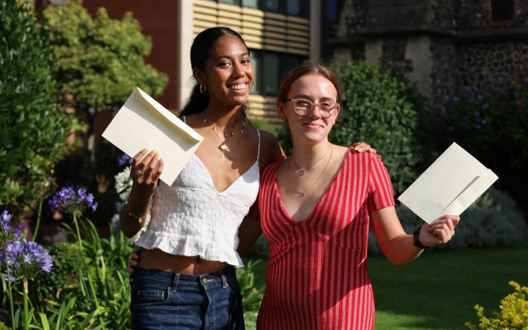  Pupils with their arms around each other celebrating their fantastic results in the Quad on A-Level Results Day 