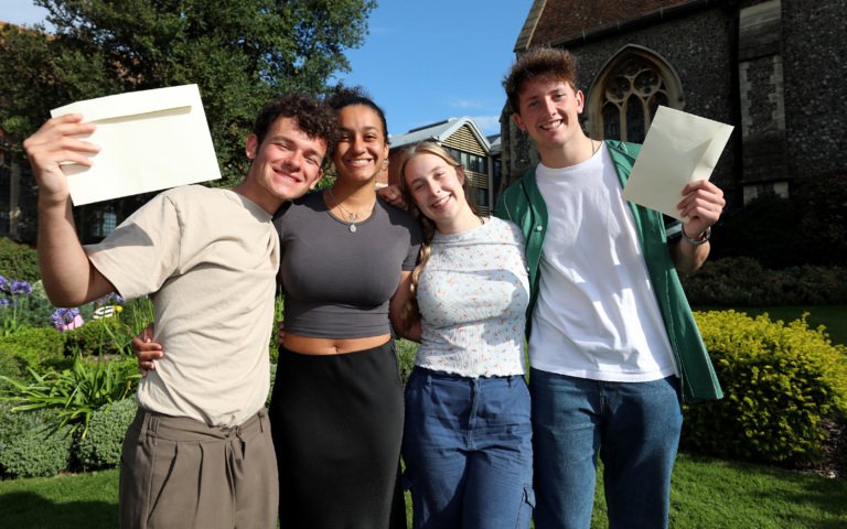  Soames Scholars in the Quad holding their results and celebrating on A-Level Results Day 