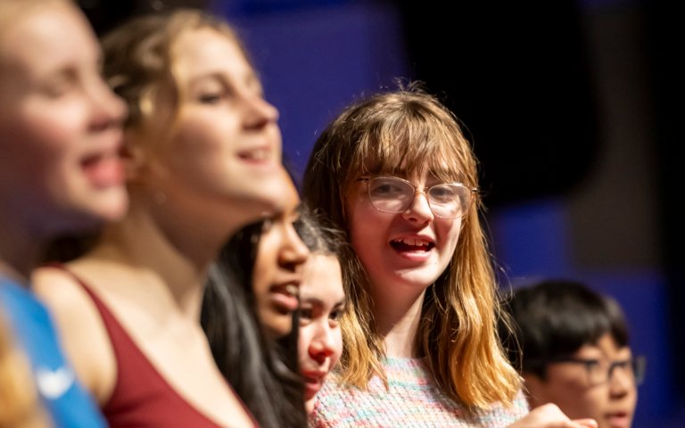  Lower School pupils singing on stage at the Film Concert 