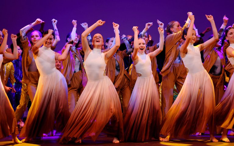  Dancers performing a large number on the stage in the Dance Show 