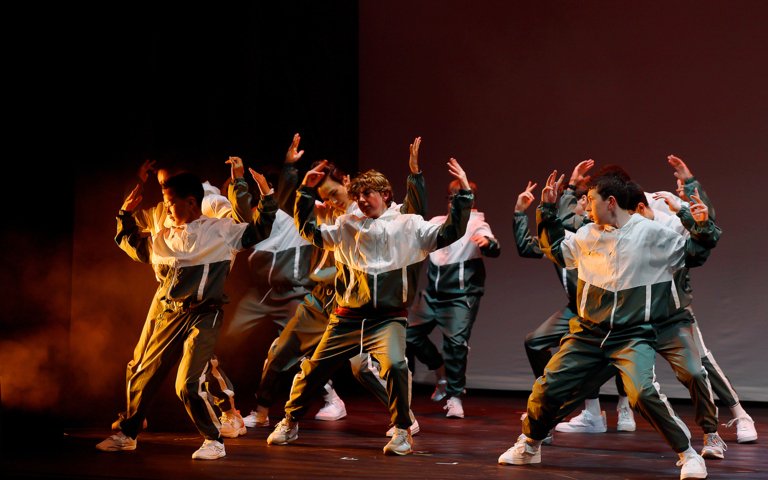  Boys Dance Troupe on the stage performing a routine at the annual Dance Show 