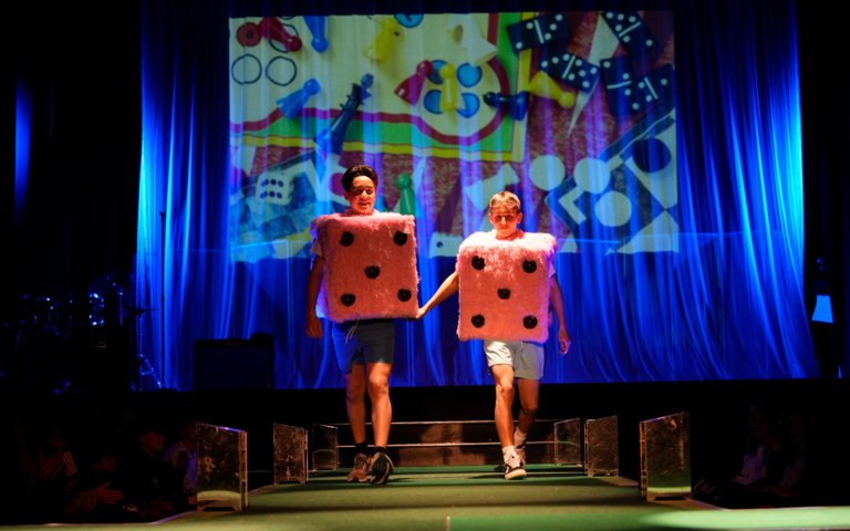  Pupils wearing fluffy oink dice costumes and walking down the catwalk in the Fenwick Fashion Show 