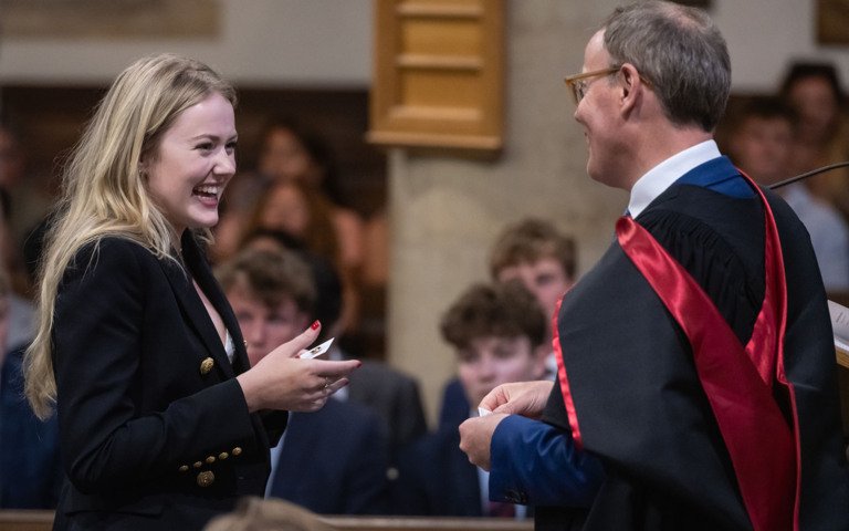  Pupil receiving their badge from Richard Cairns in the Chapel at their Graduation 