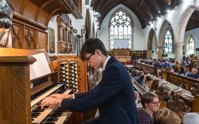  Pupil playing the Organ in the Chapel at the Graduation Ceremony 