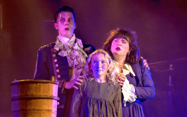  Pupils on stage playing young Cosette, and the Landlords the Thénardiers in a production of Les Misérables 