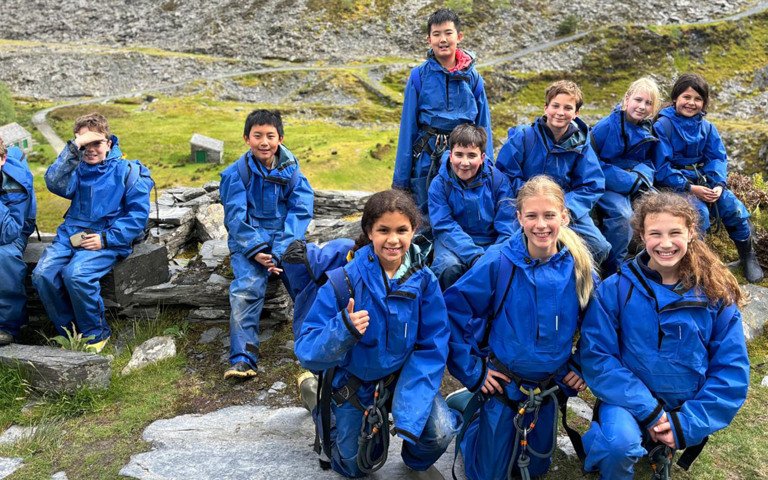  Prep School pupils with climbing harnesses on a school trip to Snowdonia 