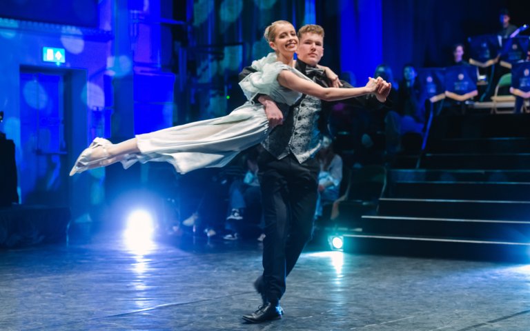  Competitors in the Strictly Come Dancing competition doing a lift on stage 