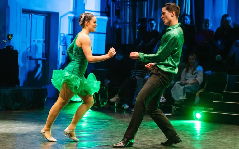  Winners of Strictly on stage dancing on stage in their matching green outfits 