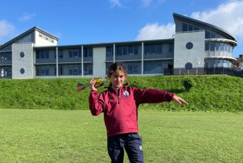 Pre-Prep pupil on the field on a sunny day preparing to throw a vortex