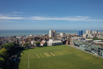 Aerial view over the Home Ground and rest of buildings with the sea in the background