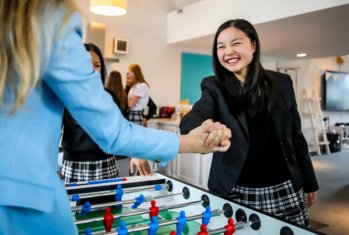 New House boarders shaking hands after a game of Table Football