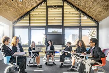 Pupils sitting in a circle with their teacher in a Religious Studies lesson in the Creative Learning Centre