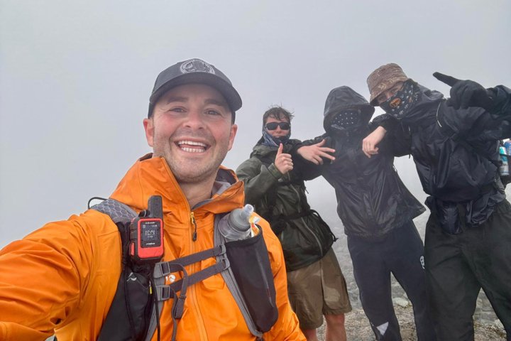  Chris Kulin and pupils braving the weather up the mountain during their Three Peaks Challenge raising money for charity 