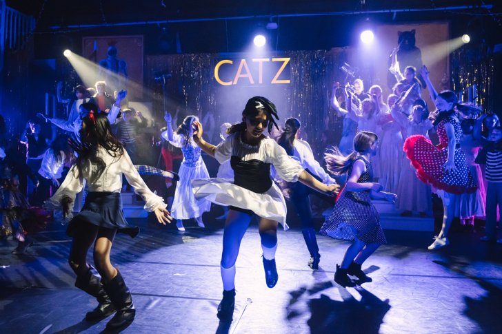  Lower School pupils dancing on stage in their production of Catz 