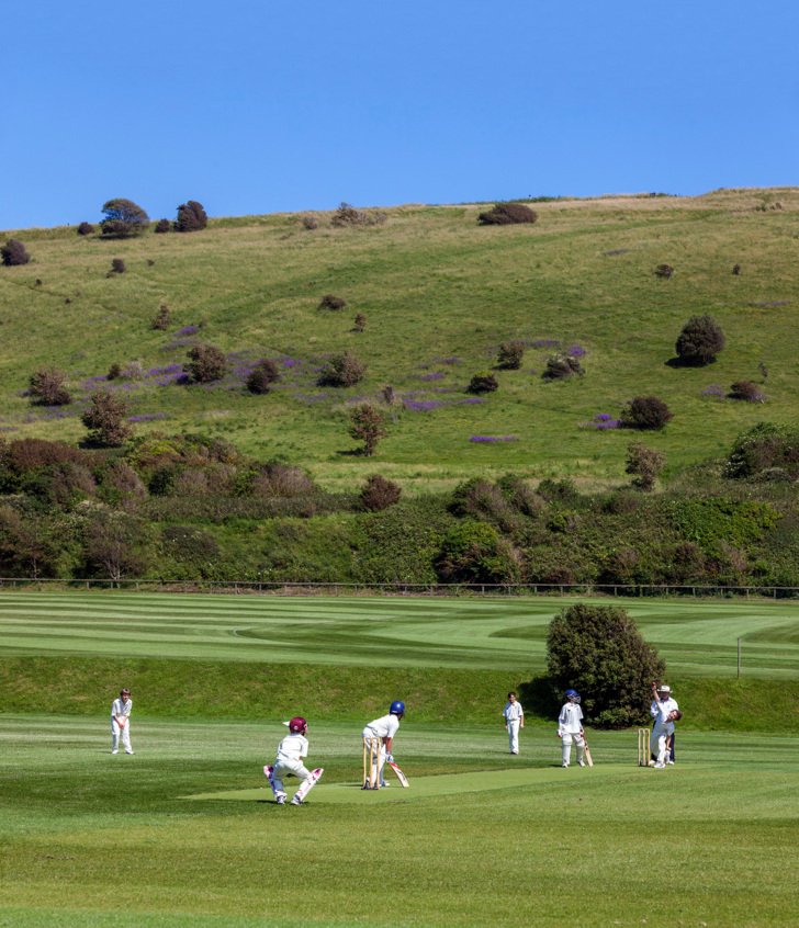  Pupils playing a Cricket match at the Jubilee Ground nestled in the South Downs 