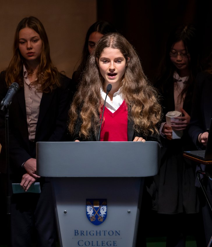  Pupil standing behind the lectern and giving a presentation as part of their EPQ qualification 