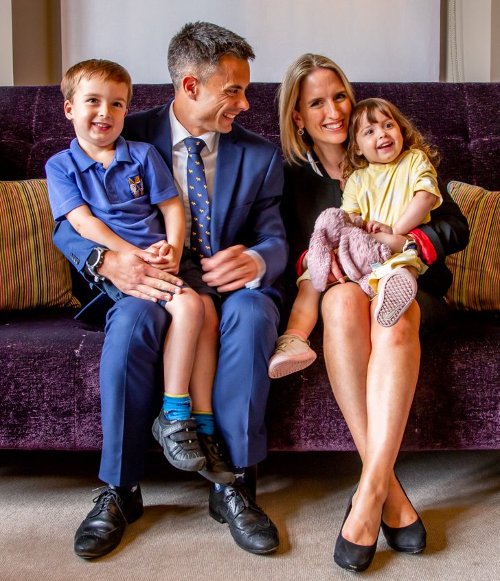  The Connor family sitting together on a sofa in Alexander House 