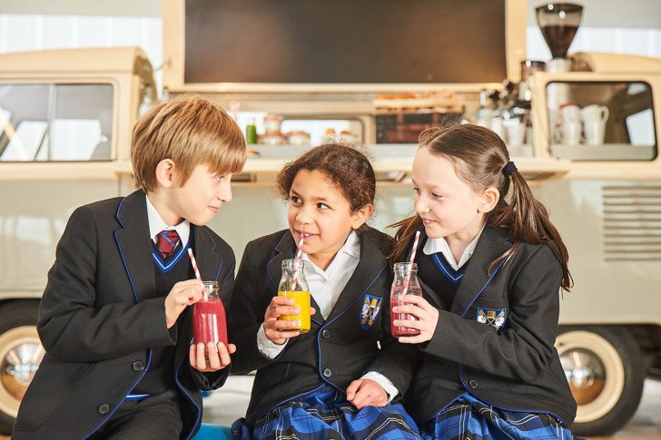  Prep School pupils enjoying drinking smoothies and chatting together in the SSS 