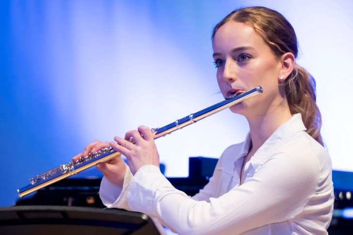  Sixth Form musician playing the flute in a concert 