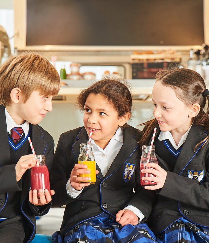  Prep School pupils enjoying drinking smoothies and chatting together in the SSS 